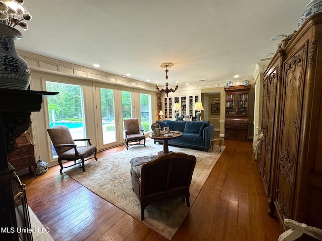 59 Dunbar Rd, Natchez, MS 39120 - living room with a chandelier, hardwood / wood-style flooring, recessed lighting, and a large fireplace