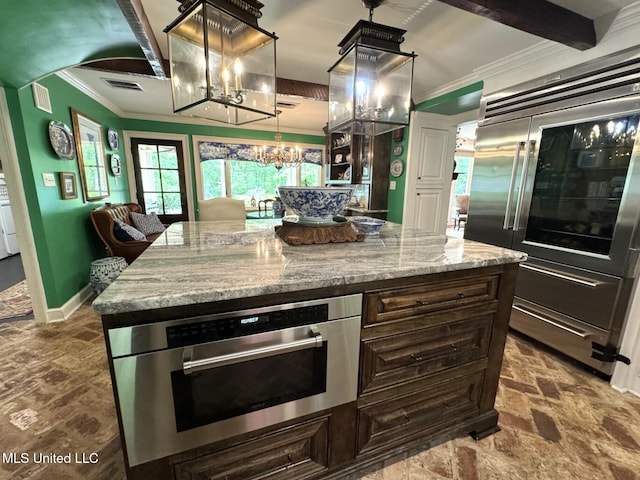 59 Dunbar Rd, Natchez, MS 39120 - kitchen featuring stainless steel built in fridge, ornamental molding, a chandelier, light stone countertops, and a kitchen island