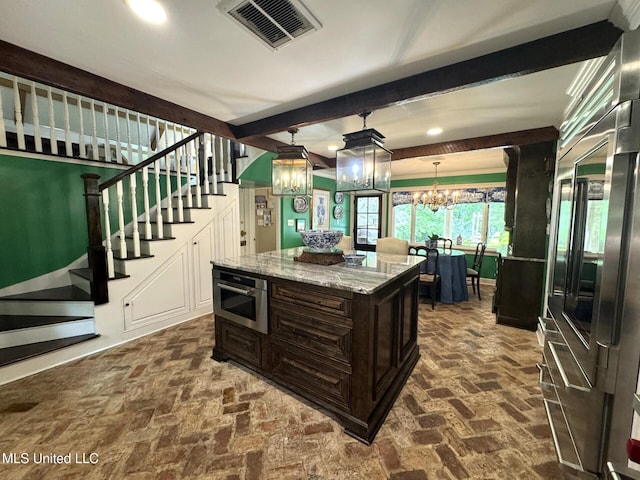 59 Dunbar Rd, Natchez, MS 39120 - kitchen with brick flooring, high end refrigerator, light stone countertops, pendant lighting, and dark brown cabinetry