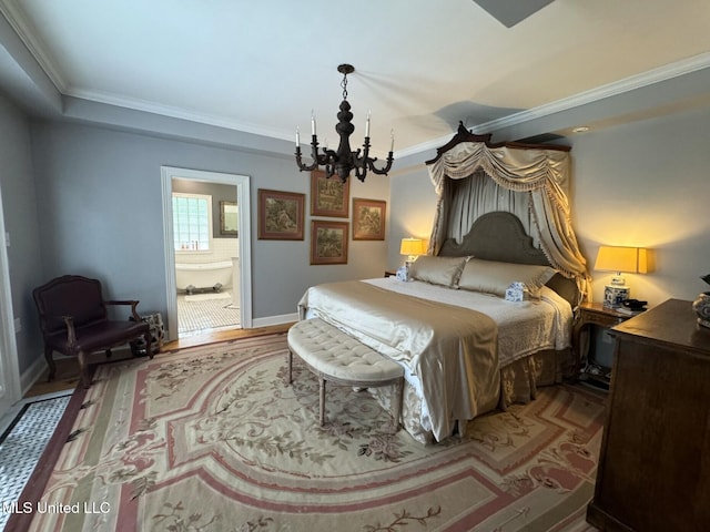 59 Dunbar Rd, Natchez, MS 39120 - bedroom featuring a chandelier, crown molding, wood finished floors, baseboards, and ensuite bathroom