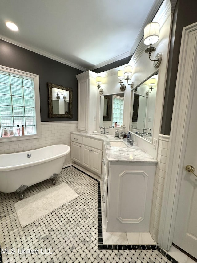 59 Dunbar Rd, Natchez, MS 39120 - bathroom with tile walls, ornamental molding, a freestanding bath, tile patterned floors, and double vanity