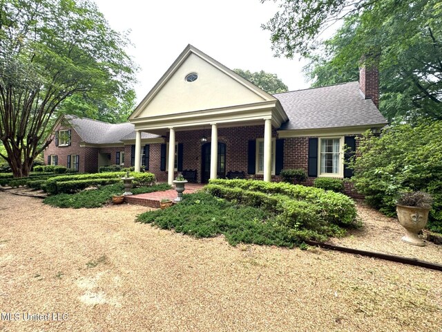 59 Dunbar Rd, Natchez, MS 39120 - neoclassical / greek revival house featuring a chimney, brick siding, and roof with shingles
