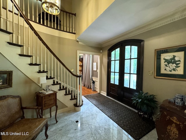 59 Dunbar Rd, Natchez, MS 39120 - entrance foyer featuring ornamental molding, stairway, and french doors