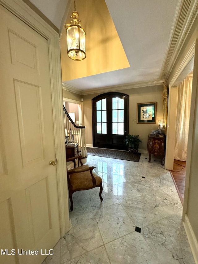 59 Dunbar Rd, Natchez, MS 39120 - foyer entrance with ornamental molding, a chandelier, french doors, stairway, and baseboards