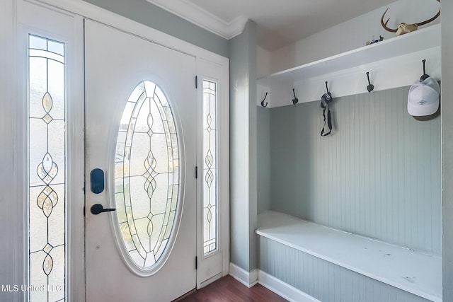 entryway with hardwood / wood-style flooring, ornamental molding, and a wealth of natural light