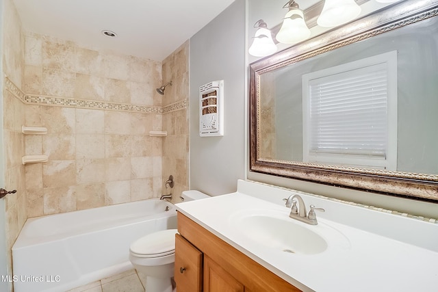 full bathroom featuring tiled shower / bath, vanity, toilet, and tile patterned flooring