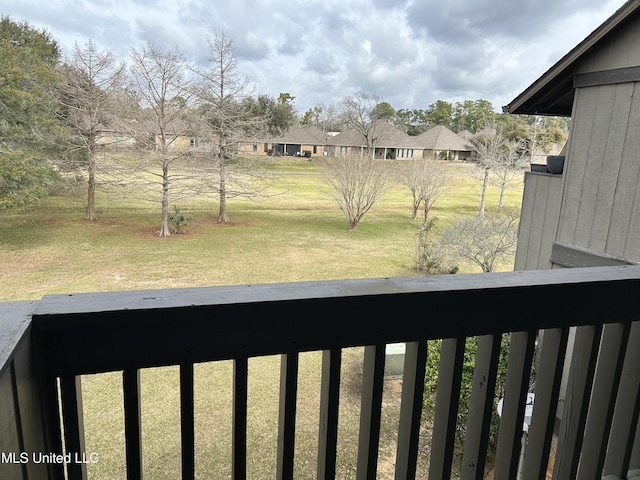 view of yard with a balcony