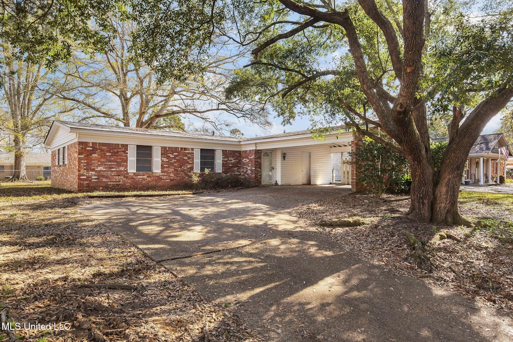 ranch-style house with a carport