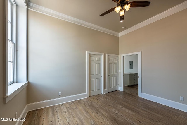 433 Main St, Natchez, MS 39120 - unfurnished room featuring a ceiling fan, ornamental molding, wood finished floors, a towering ceiling, and electric panel