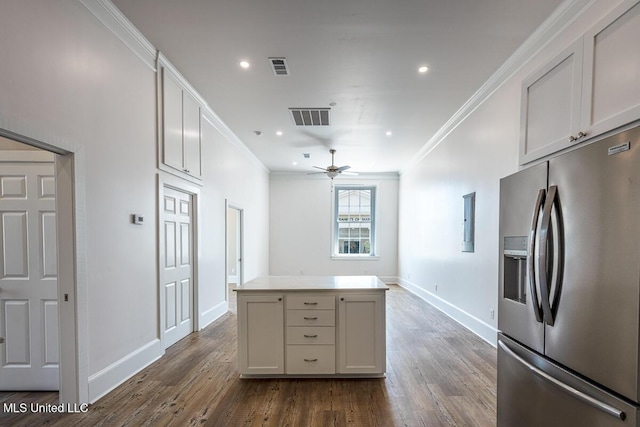 433 Main St, Natchez, MS 39120 - kitchen featuring stainless steel fridge with ice dispenser, ornamental molding, ceiling fan, dark wood-style floors, and a kitchen island
