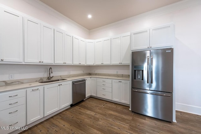 433 Main St, Natchez, MS 39120 - kitchen with stainless steel appliances, ornamental molding, light stone countertops, dark wood-style floors, and white cabinets