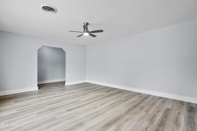 spare room featuring ceiling fan and light hardwood / wood-style flooring