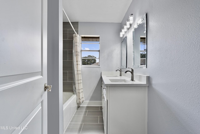 bathroom featuring vanity and shower / tub combo with curtain