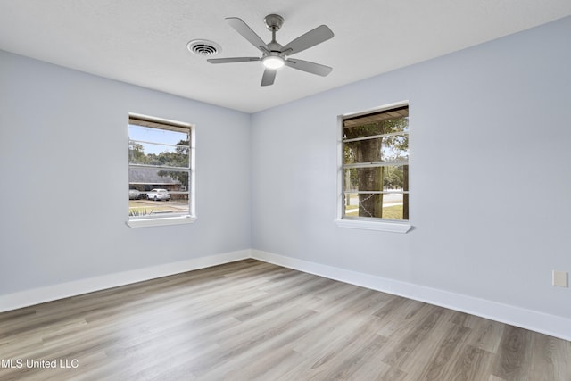 spare room featuring ceiling fan and light wood-type flooring