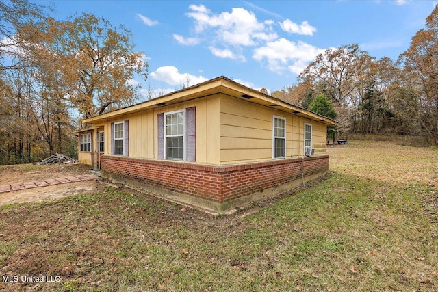 view of home's exterior with a yard