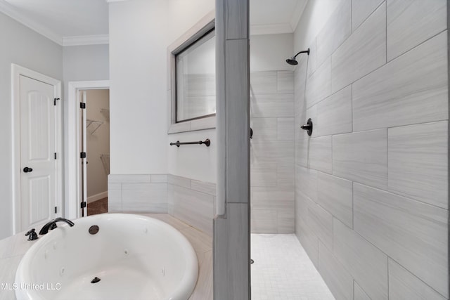 bathroom with a walk in closet, tiled shower, crown molding, and a tub with jets