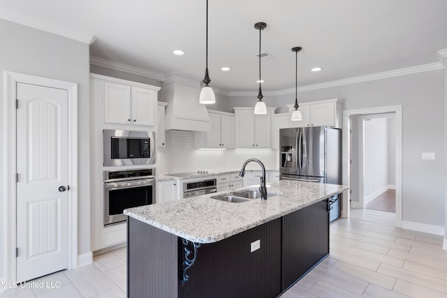 kitchen with stainless steel appliances, a sink, white cabinetry, decorative backsplash, and crown molding