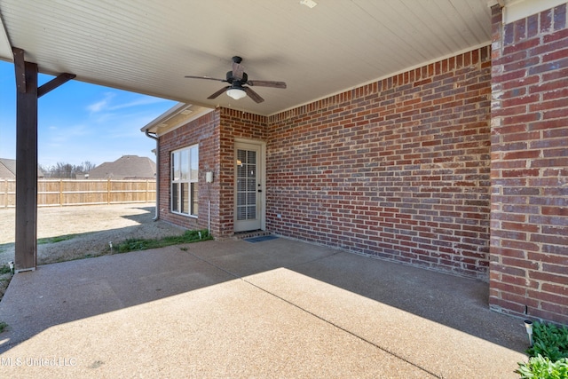 view of patio / terrace featuring ceiling fan and fence