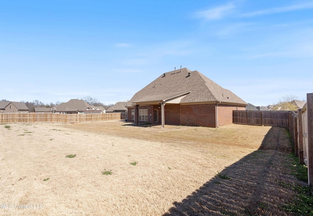 view of yard with a fenced backyard