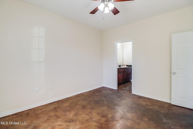 unfurnished bedroom featuring ensuite bathroom and ceiling fan