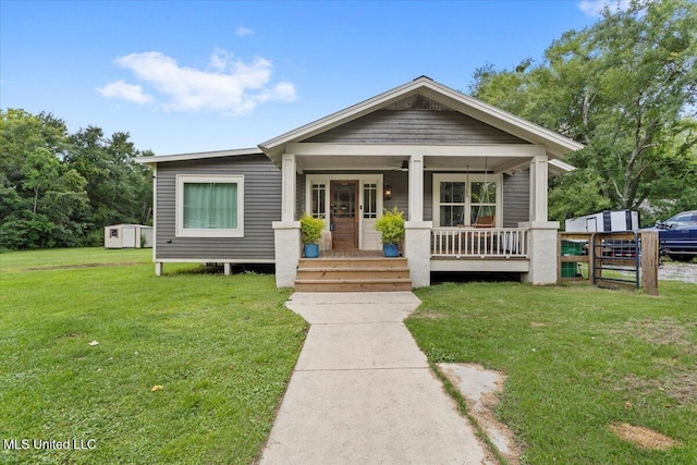 7101 Wayne Ln, Biloxi, MS 39532 - view of front of house featuring covered porch and a front yard