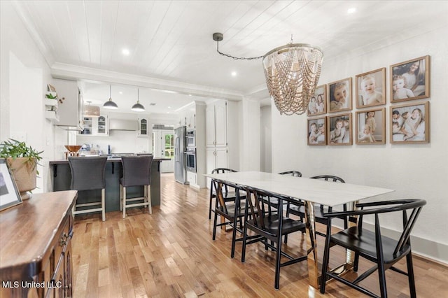 7101 Wayne Ln, Biloxi, MS 39532 - dining area featuring ornamental molding, light wood-style floors, wooden ceiling, a chandelier, and recessed lighting