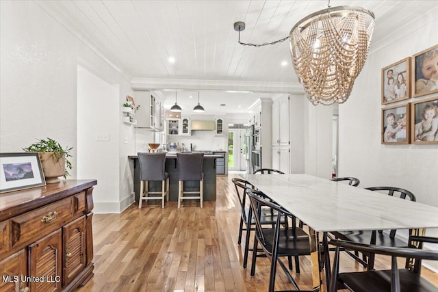 7101 Wayne Ln, Biloxi, MS 39532 - dining room with crown molding, light wood-type flooring, a chandelier, and wood ceiling