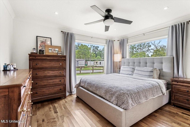 7101 Wayne Ln, Biloxi, MS 39532 - bedroom with wood finished floors, recessed lighting, crown molding, and ceiling fan