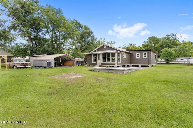 7101 Wayne Ln, Biloxi, MS 39532 - back of property featuring a detached carport and a lawn