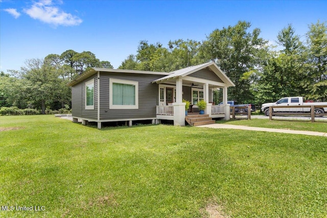 7101 Wayne Ln, Biloxi, MS 39532 - view of front of house with a porch, ceiling fan, and a front lawn