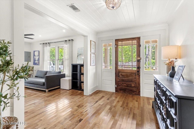 7101 Wayne Ln, Biloxi, MS 39532 - entrance foyer with light wood-style floors, crown molding, and ceiling fan