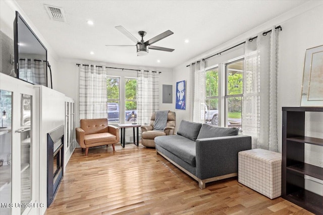 7101 Wayne Ln, Biloxi, MS 39532 - living room featuring plenty of natural light, a ceiling fan, light wood finished floors, recessed lighting, and electric panel
