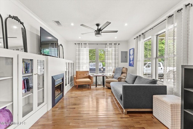 7101 Wayne Ln, Biloxi, MS 39532 - living area featuring a ceiling fan, wood finished floors, recessed lighting, crown molding, and electric panel