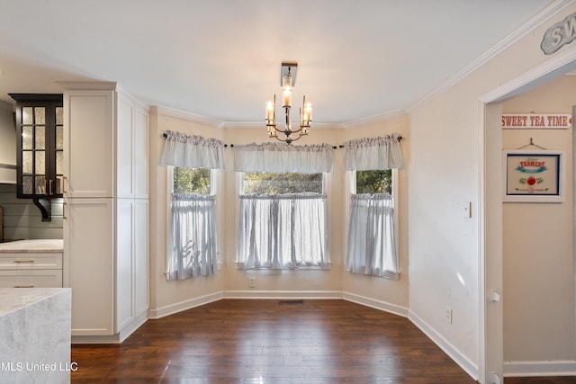 190 Briarwood Dr, Holly Springs, MS 38635 - unfurnished dining area featuring a chandelier, healthy amount of natural light, dark wood-style floors, baseboards, and ornamental molding