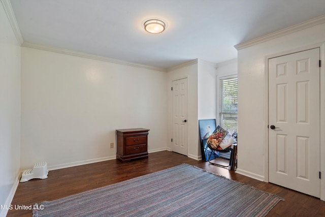 unfurnished bedroom with dark hardwood / wood-style floors and crown molding