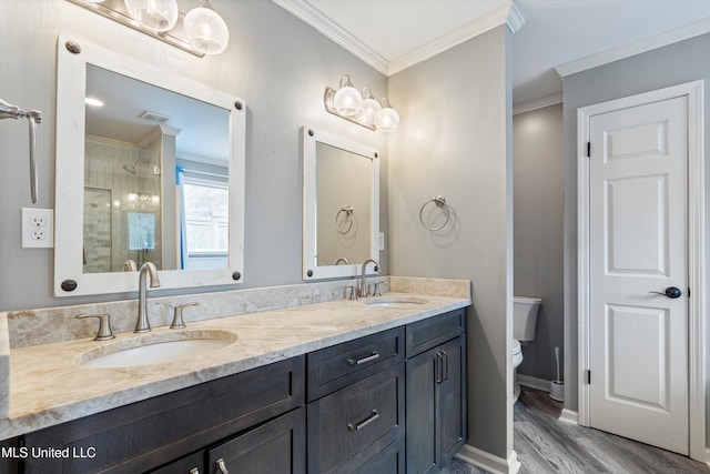 190 Briarwood Dr, Holly Springs, MS 38635 - full bathroom with wood finished floors, a shower stall, ornamental molding, toilet, and double vanity