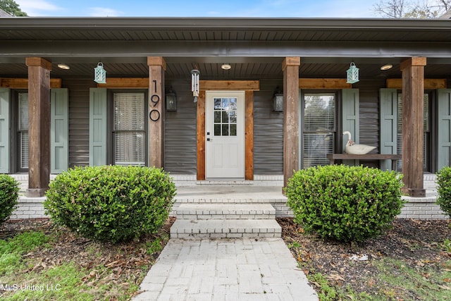 entrance to property with a porch