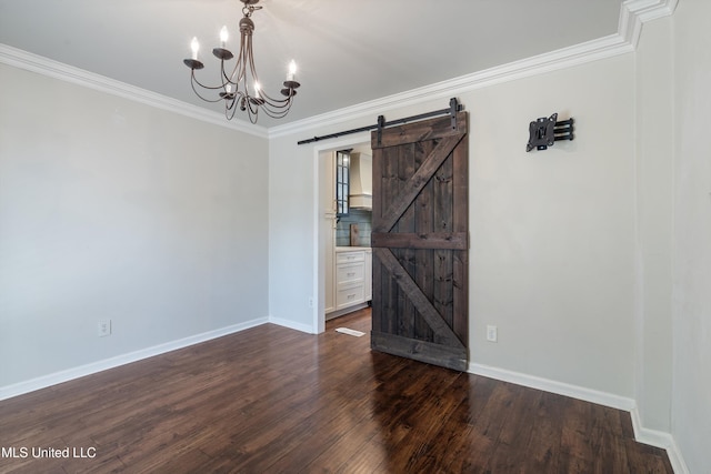 190 Briarwood Dr, Holly Springs, MS 38635 - empty room with a barn door, ornamental molding, baseboards, a chandelier, and dark wood-type flooring