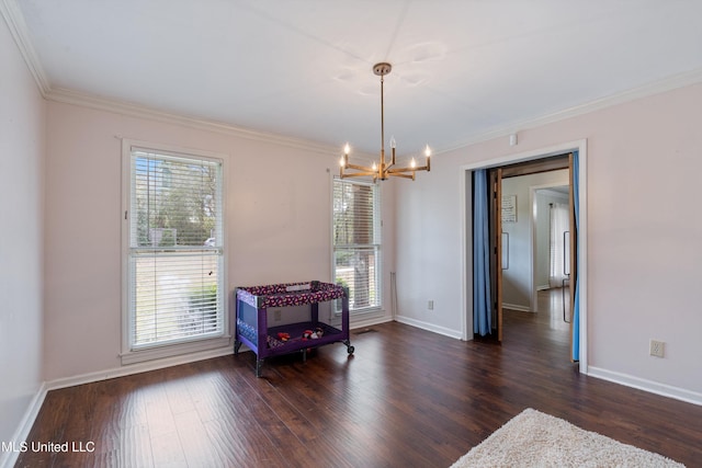 190 Briarwood Dr, Holly Springs, MS 38635 - empty room with a chandelier, crown molding, plenty of natural light, dark wood finished floors, and baseboards