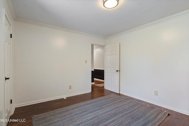 190 Briarwood Dr, Holly Springs, MS 38635 - spare room featuring dark wood-style floors, crown molding, and baseboards