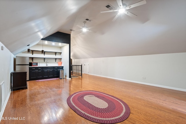 190 Briarwood Dr, Holly Springs, MS 38635 - additional living space with lofted ceiling, ceiling fan, a sink, light wood-style floors, and baseboards