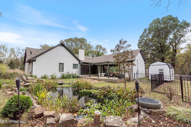 back of house with a patio