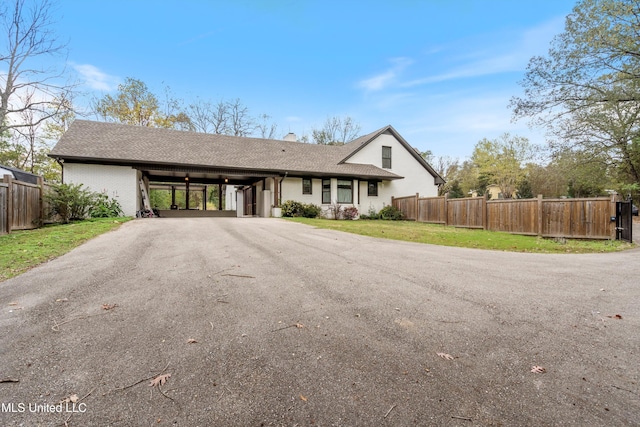 single story home with a carport