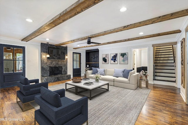 190 Briarwood Dr, Holly Springs, MS 38635 - living area featuring a premium fireplace, baseboards, wood-type flooring, beamed ceiling, and recessed lighting