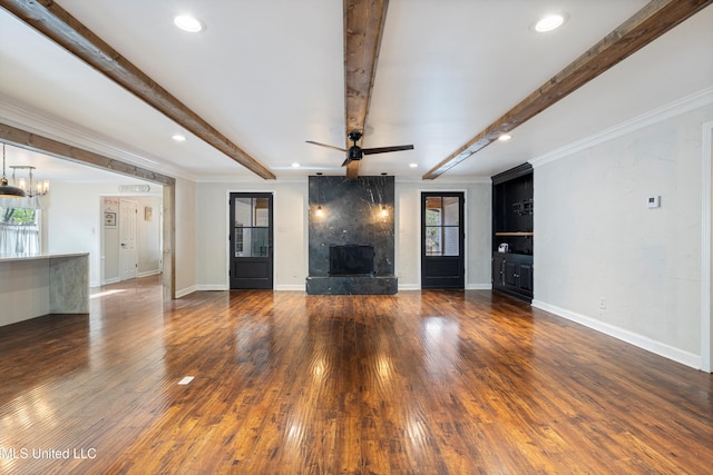 190 Briarwood Dr, Holly Springs, MS 38635 - unfurnished living room featuring a high end fireplace, wood finished floors, beam ceiling, baseboards, and a ceiling fan