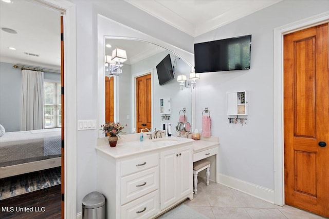 bathroom with vanity, ornamental molding, and tile patterned floors