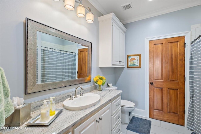 bathroom with vanity, toilet, ornamental molding, and tile patterned flooring