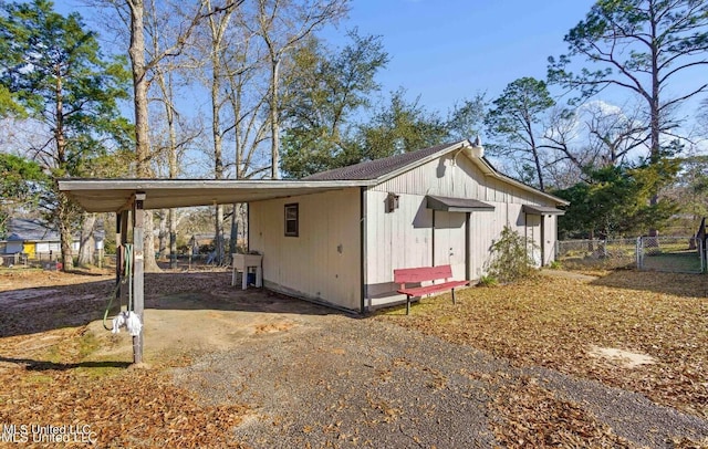 view of side of property with a carport