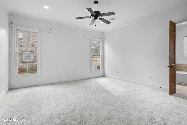 carpeted spare room with ornamental molding and ceiling fan