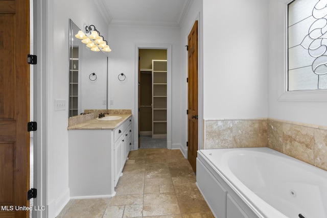 bathroom featuring a washtub, vanity, and ornamental molding